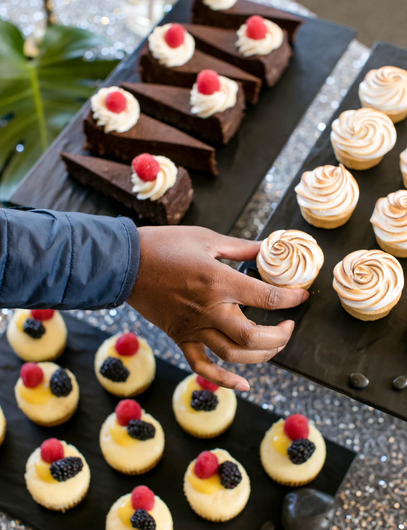 Dessert display table with guest selecting a dessert