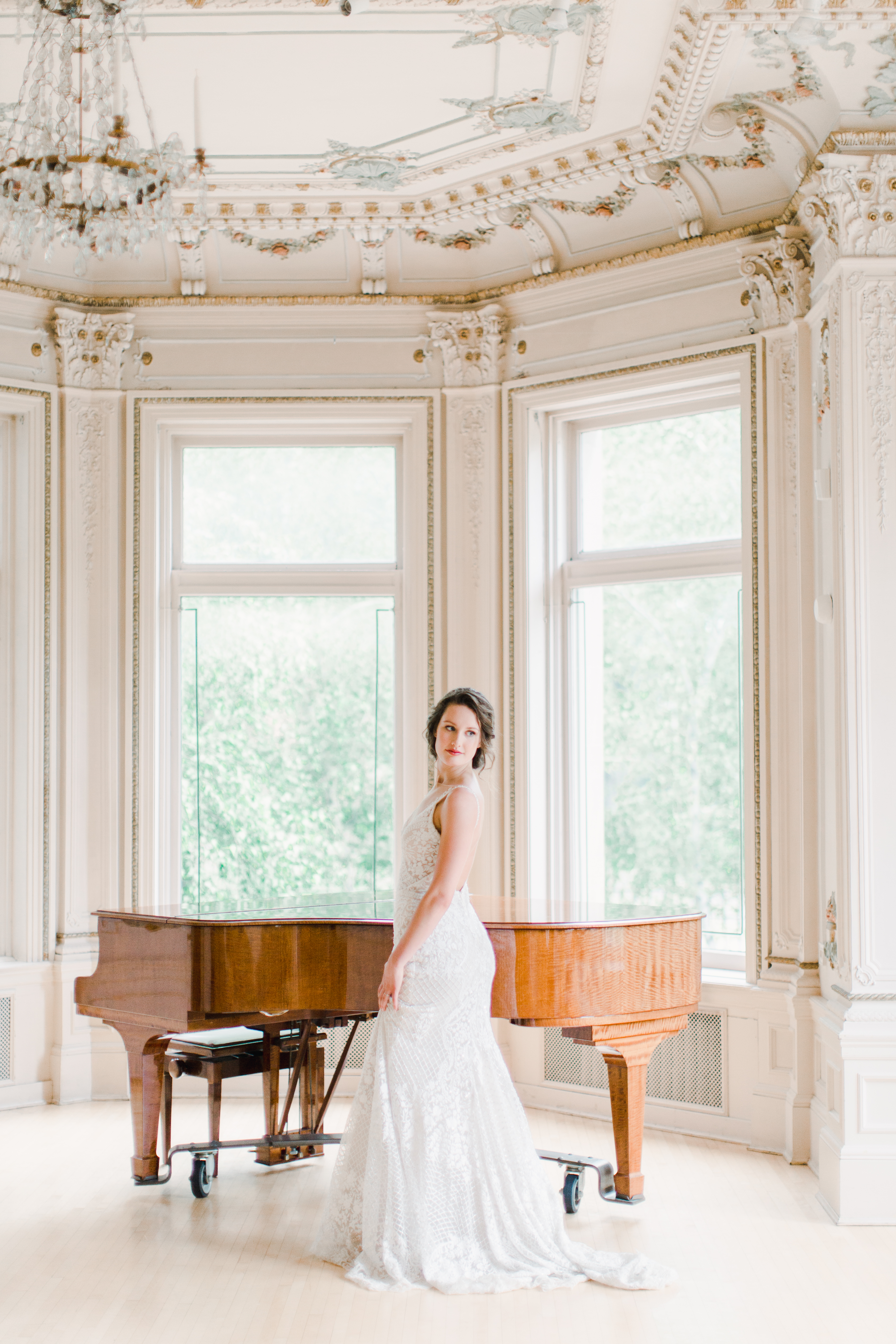 Bridal portrait inside the historical museum in front of a piano