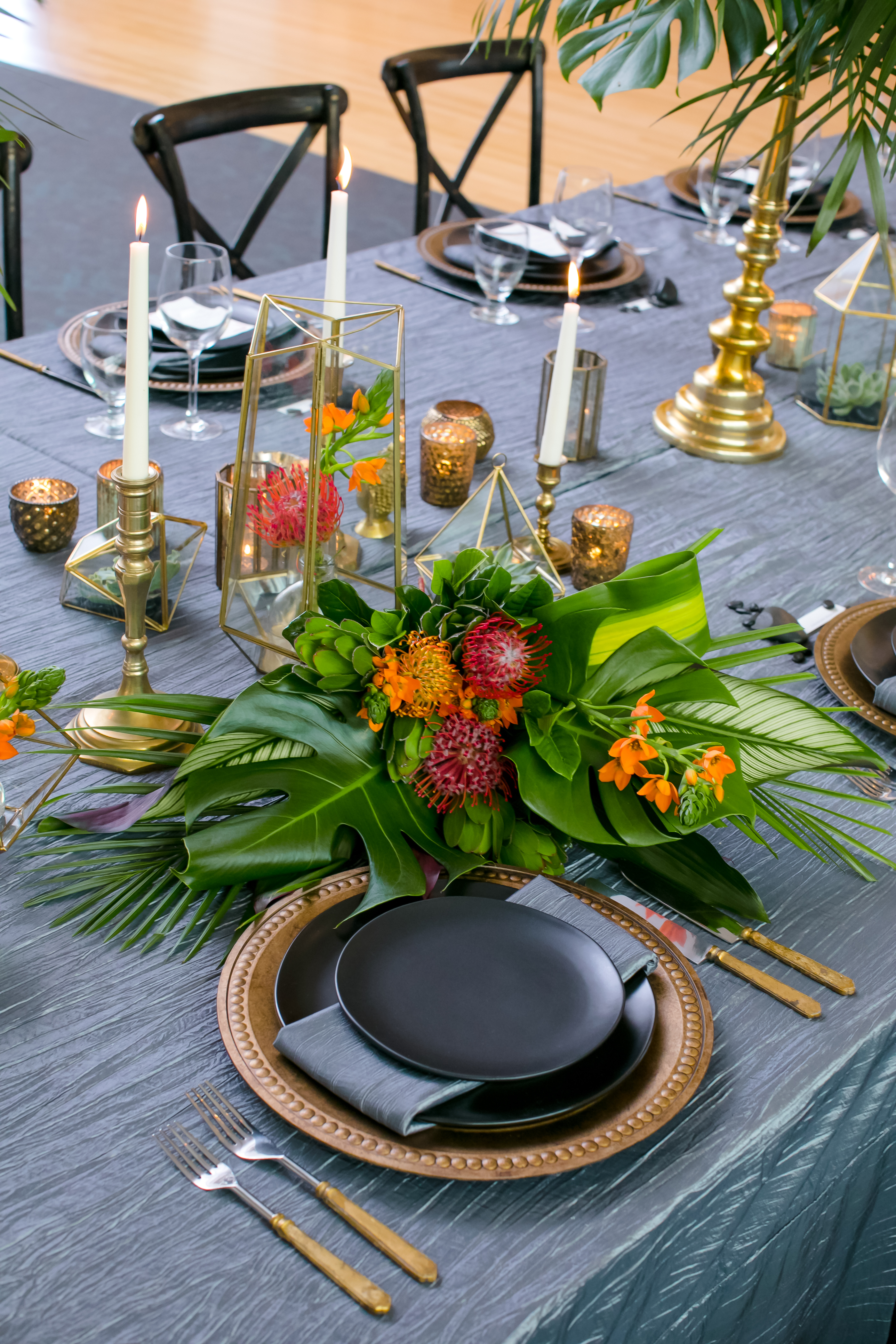 Wedding reception table setting with tropical florals